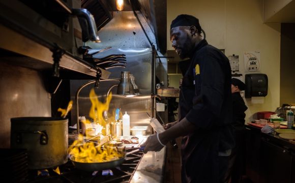Chef cooking in Downtown Bettendorf, IA