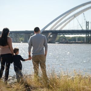 Family looking at the Mississippi River in Bettendorf Iowa