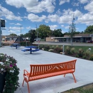 Orange Park bench in the middle of a patio